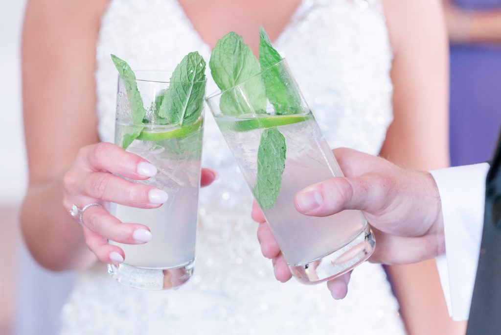 bride and groom toast mojitos