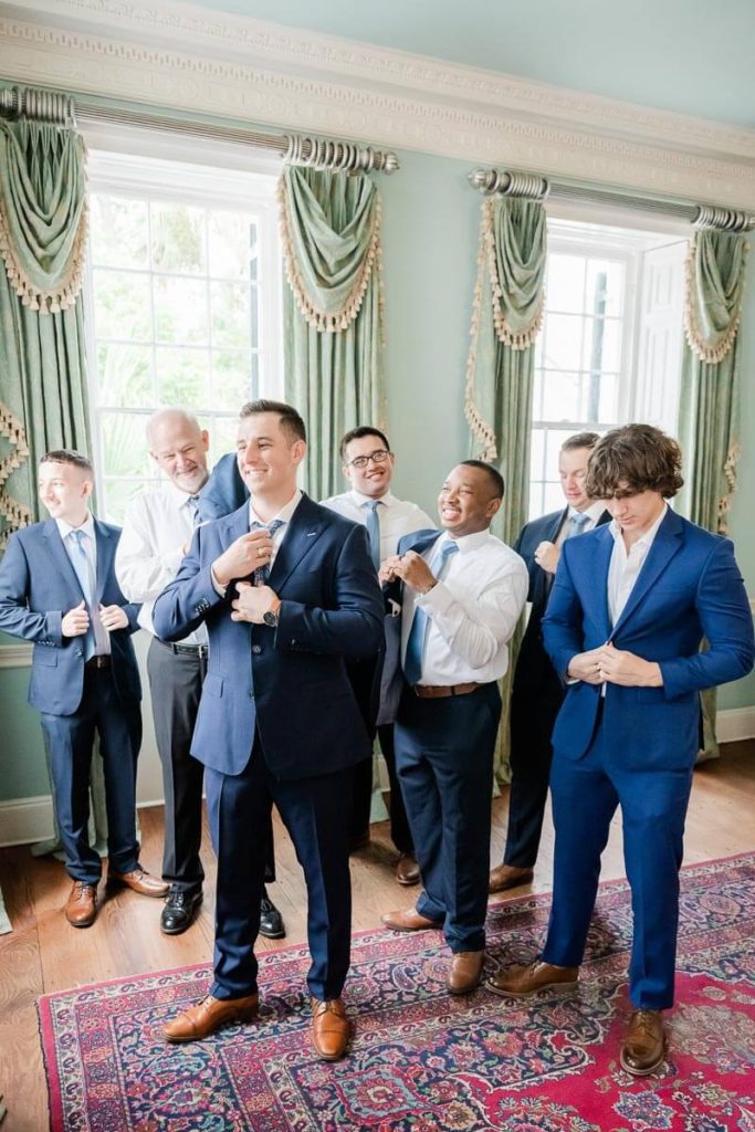 Groom getting ready inside Lowndes Grove Historic House