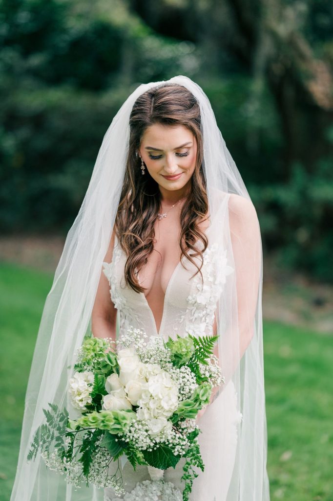 bride looking down at her bouquet