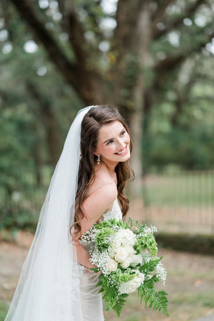 bride looking over shoulder laughing