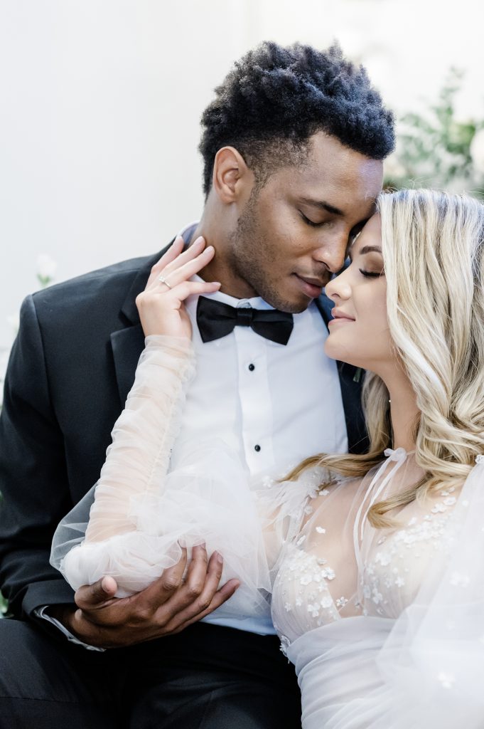 close up of bride and groom nuzzling noses