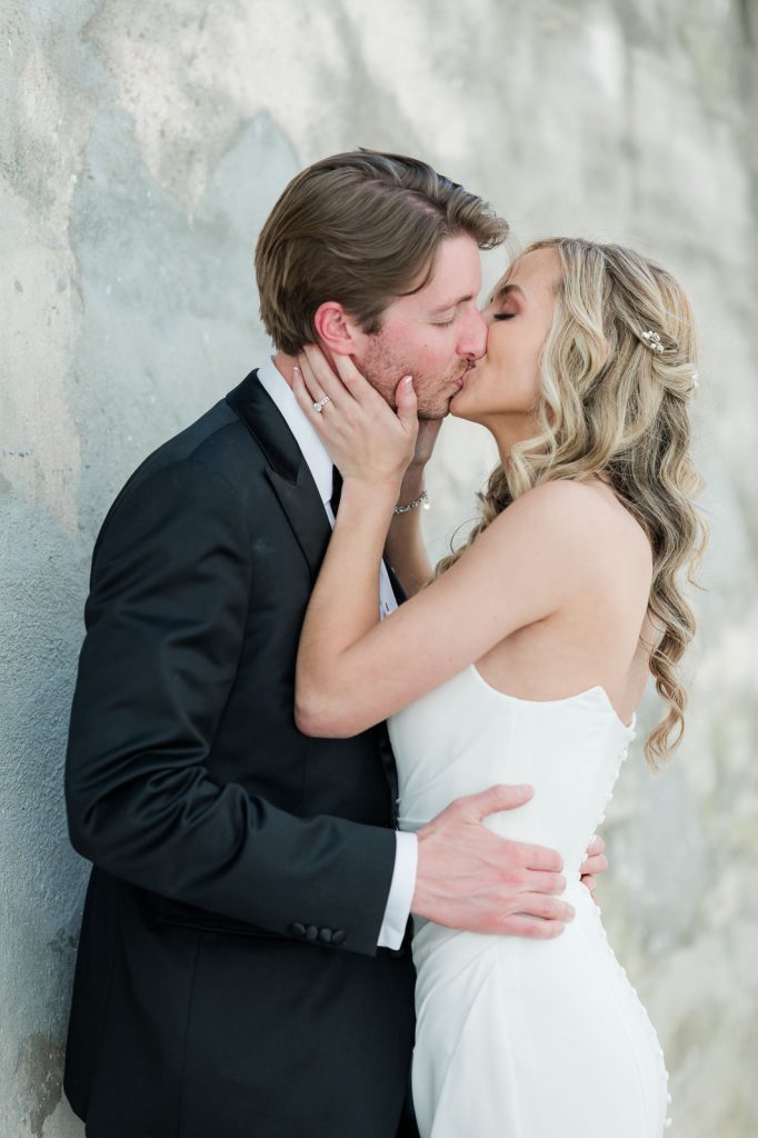 newlyweds kiss in alley