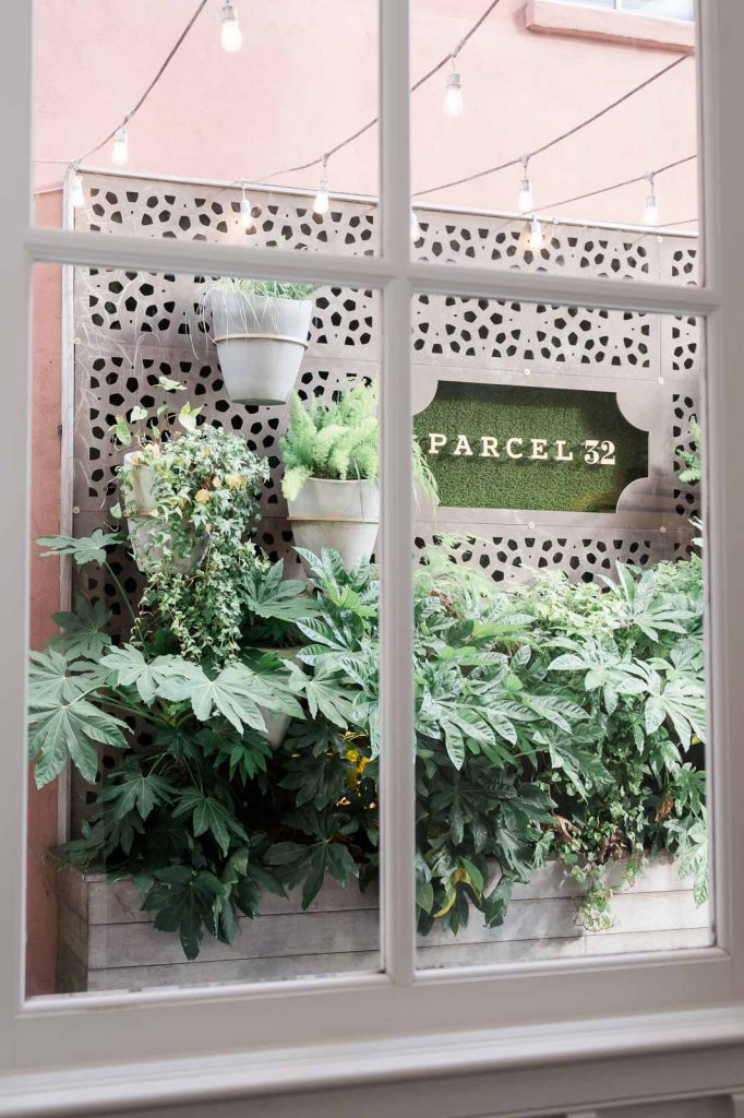 photograph from inside looking outside to the exterior sign of Parcel 32