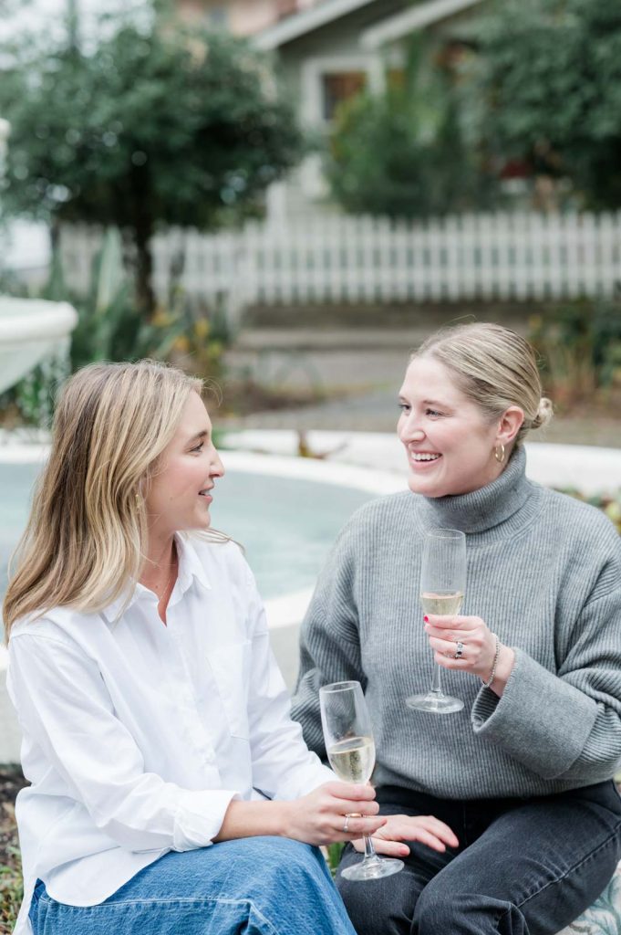 Newly engaged couple toast engagement with champagne