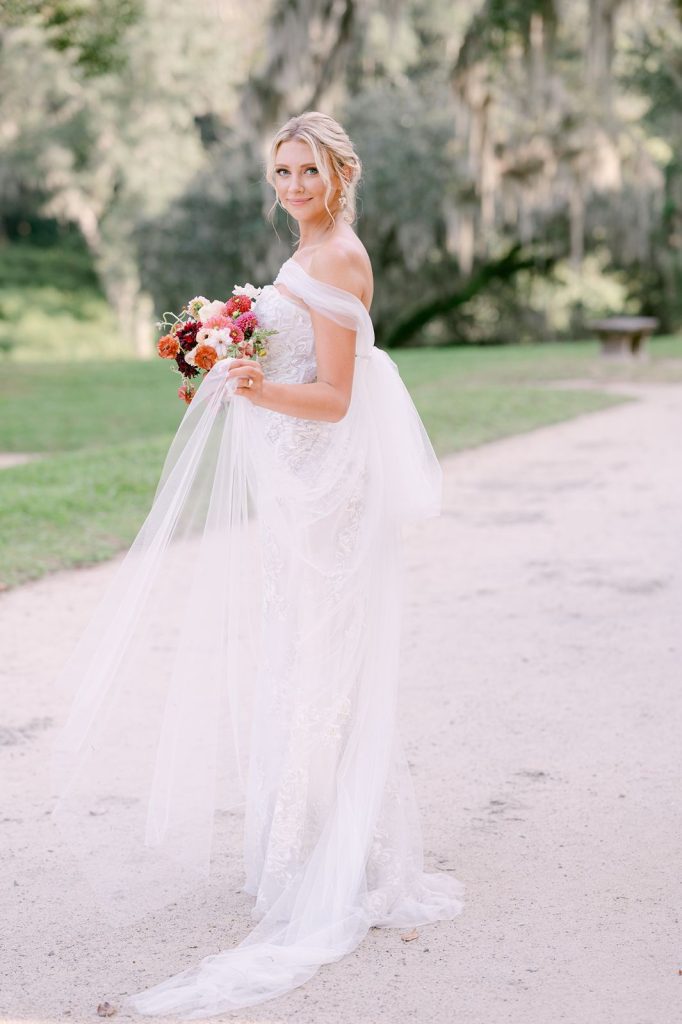 bride swishing the tulle of her wedding dress