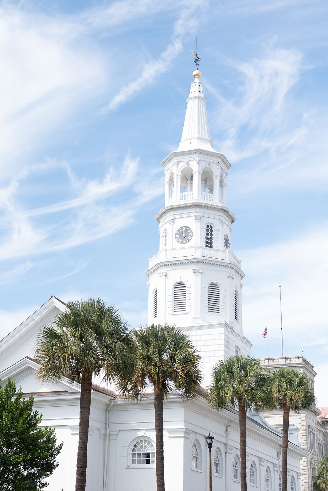 white church steeple and blue sky