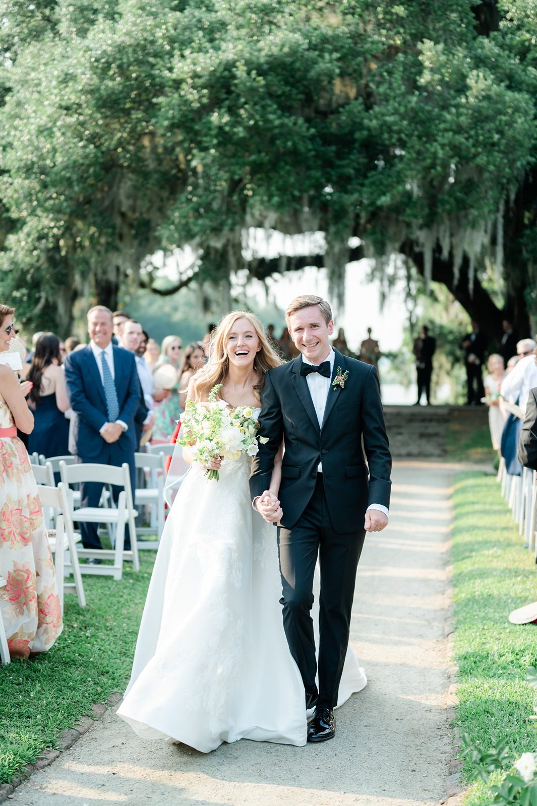 bride and groom walk down aisle after getting married