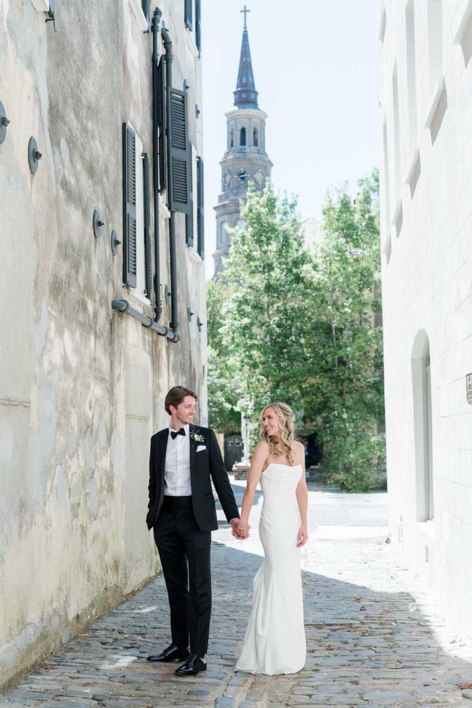 newlywed couples hold hands in Lodge Alley