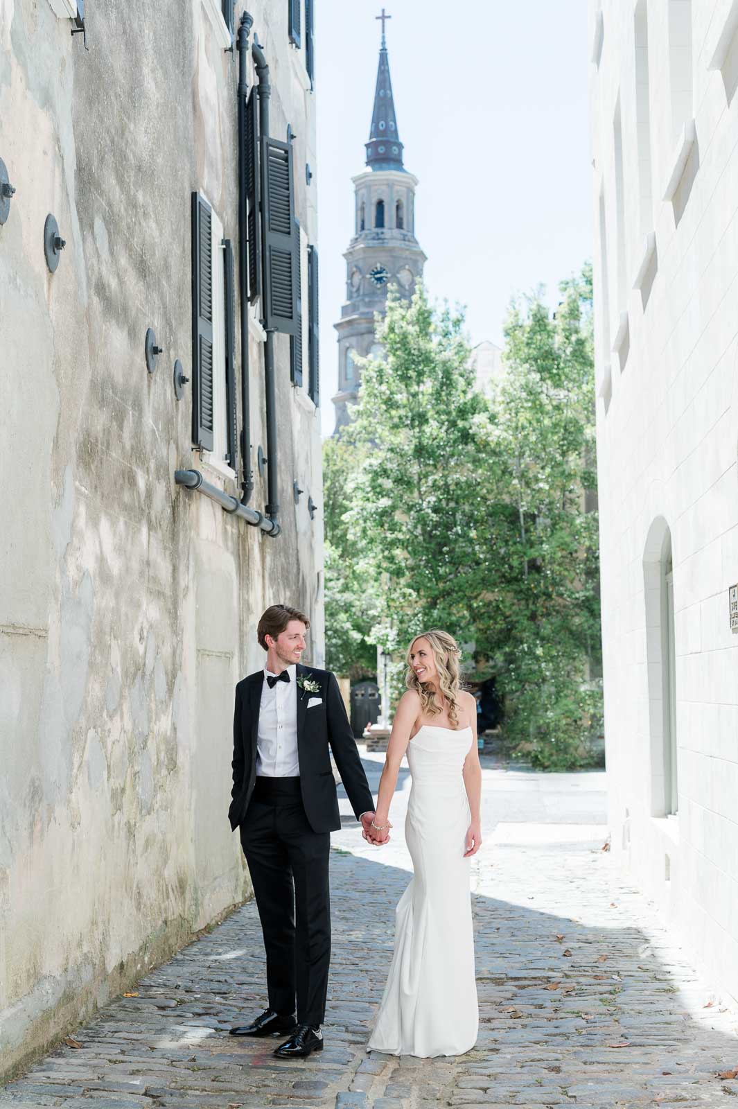 newlywed couples hold hands in Lodge Alley